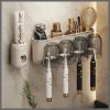 Toothbrush organiser with toothpaste dispenser
