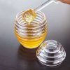 Acrylic honey dispenser comes with dipper