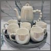 Fine ceramic 8pc Rotating tray tea set with 6 cups and kettle