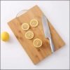 Heavy wooden chopping board with metallic handle