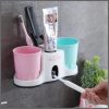 Toothbrush holder with toothpaste dispenser