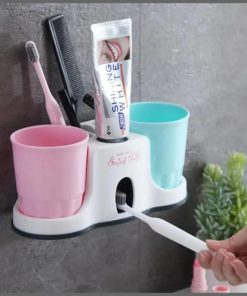 Toothbrush holder with toothpaste dispenser