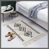 Bohemian Nordic style bedroom rug with tassels