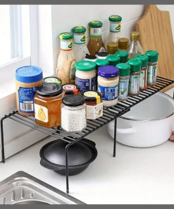 Expandable shelf raiser